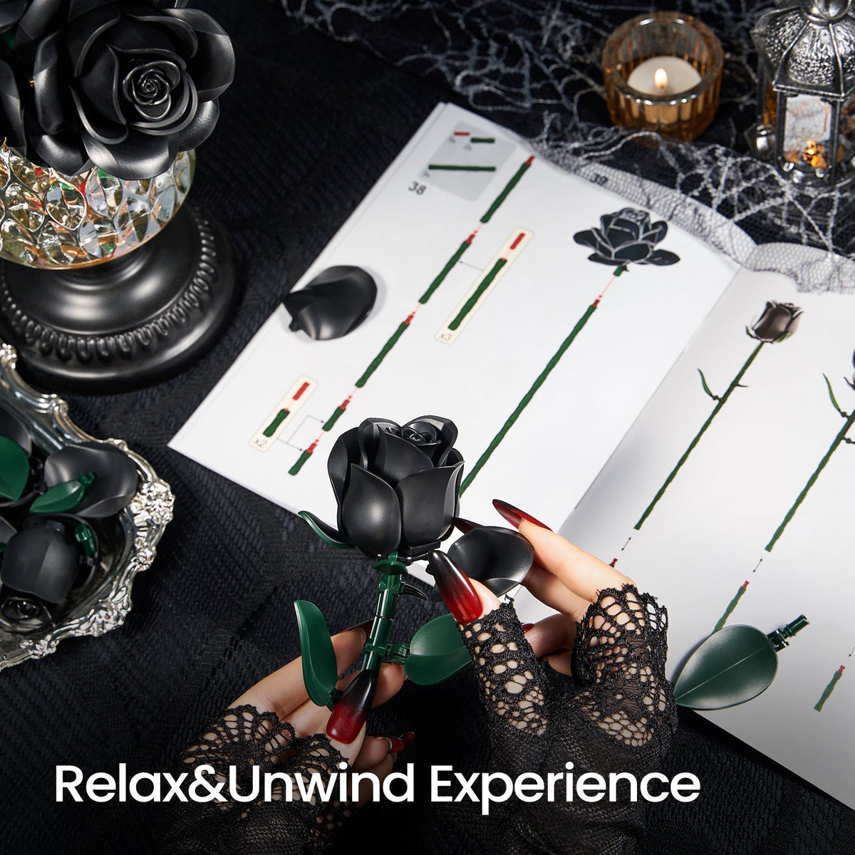 Hands assembling a black rose from building blocks beside the illustrated guide