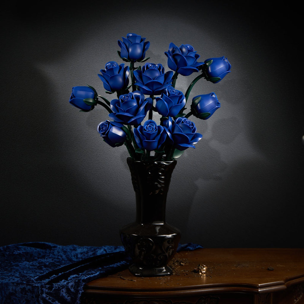 Blue rose bouquet in a carved dark vase with blue velvet drapery