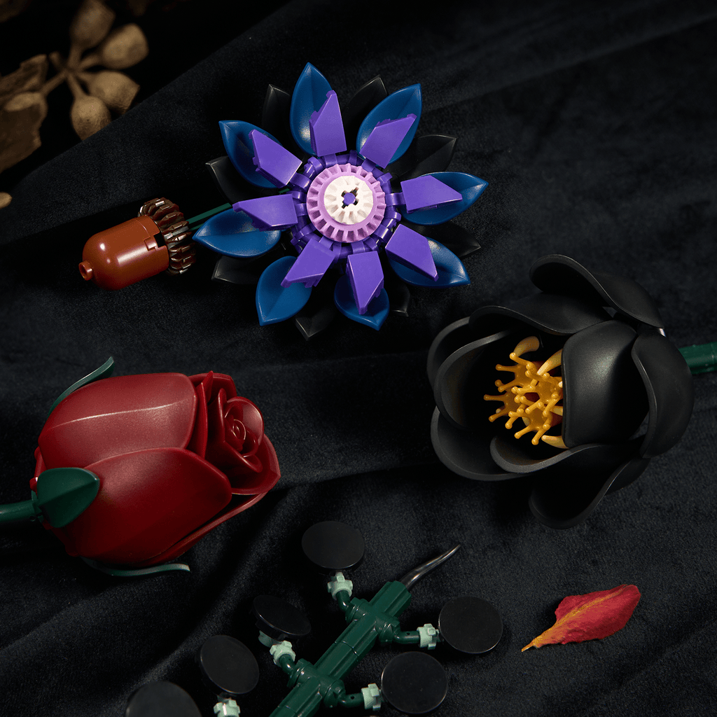 Close-up of black and deep red roses and purple petals built from interlocking pieces - Petaloo