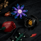Close-up of black and deep red roses and purple petals built from interlocking pieces - Petaloo