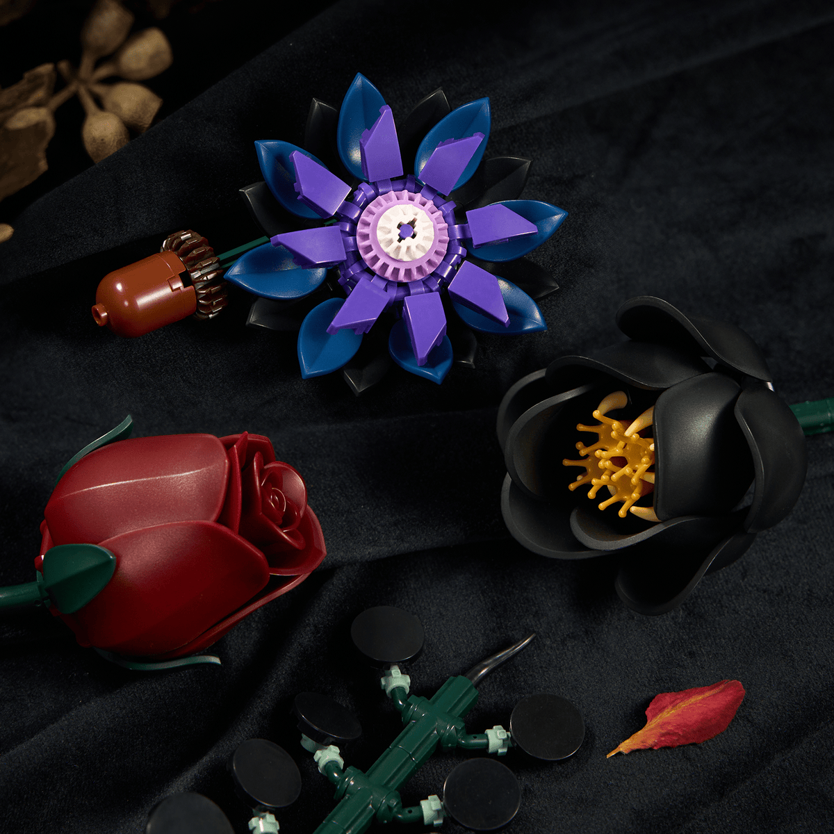 Close-up of black and deep red roses and purple petals built from interlocking pieces - Petaloo