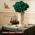 Green roses in a cream vase on a table dressed with a green cloth