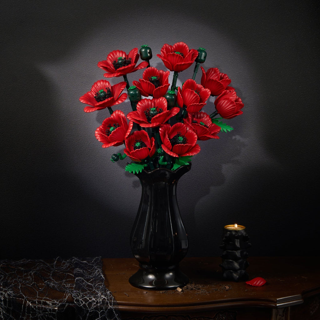 Red poppy bouquet in a black vase on an antique table against a dark background